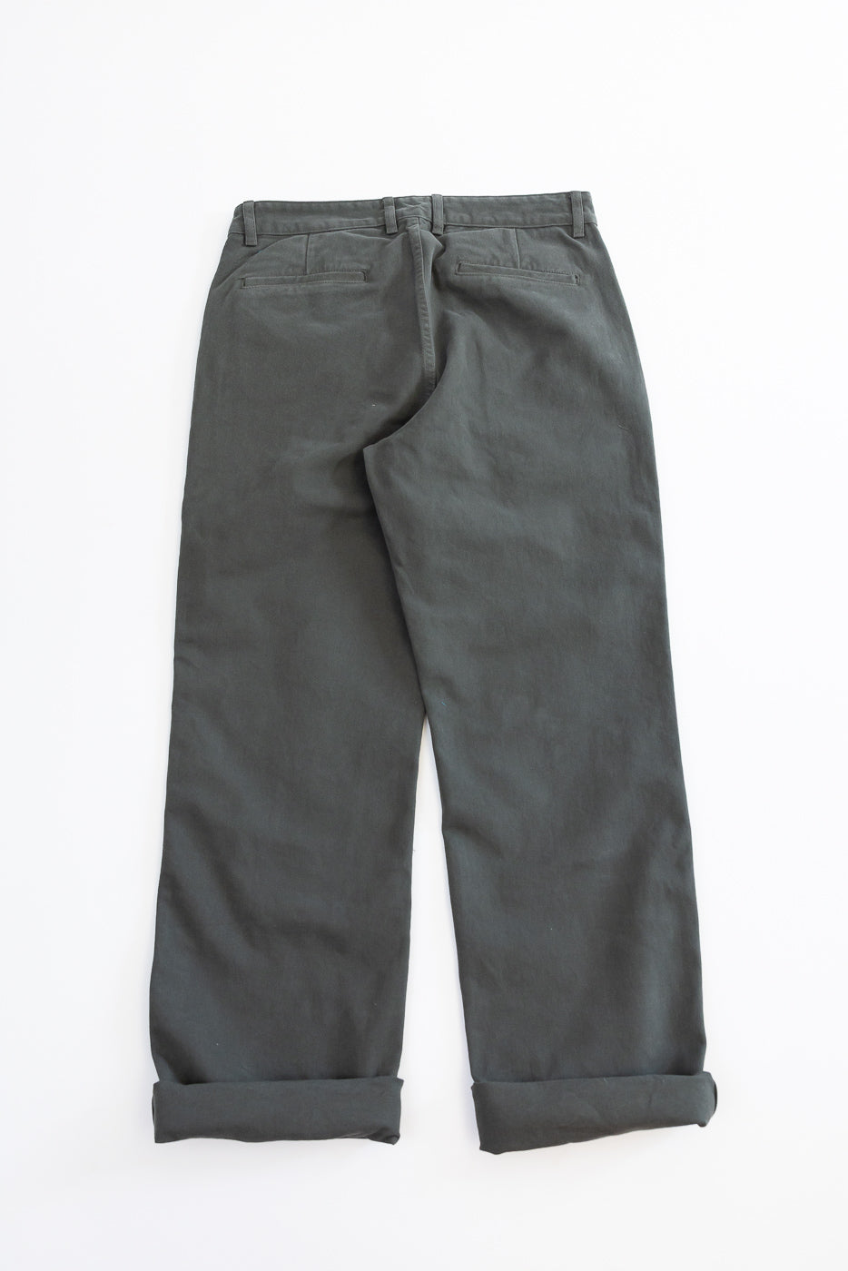 Gray pants with rolled-up cuffs on a white background