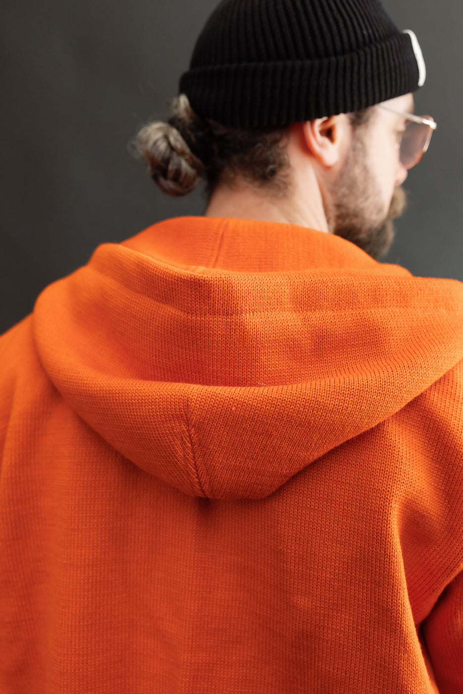 close up of orange knitted hood