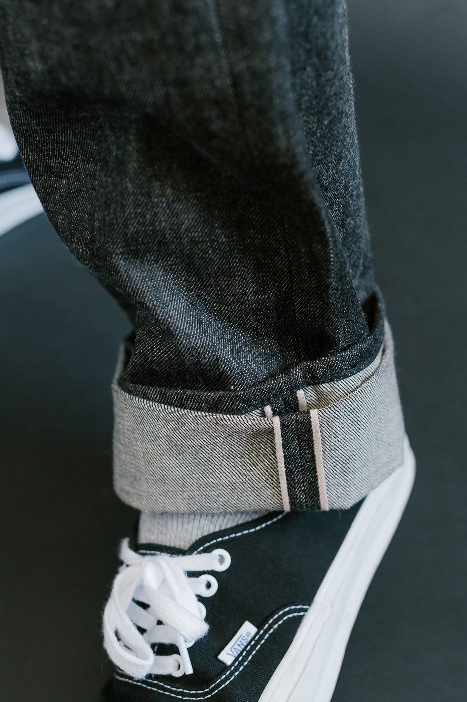 close up of on body denime black x mother cotton selvedge id on cuff