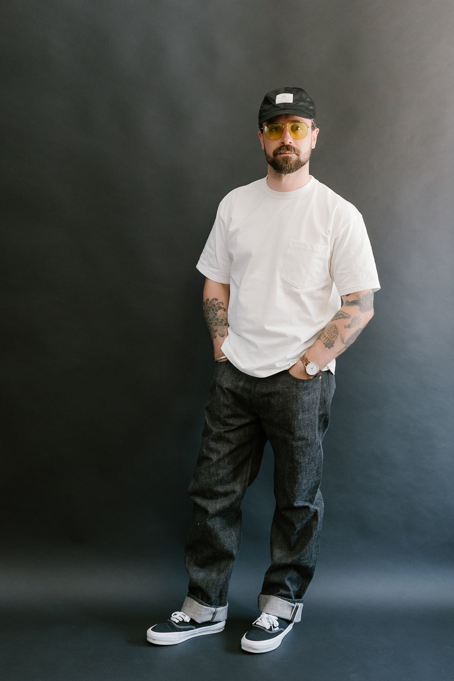 man wearing black mother cotton denim jeans full body, front
