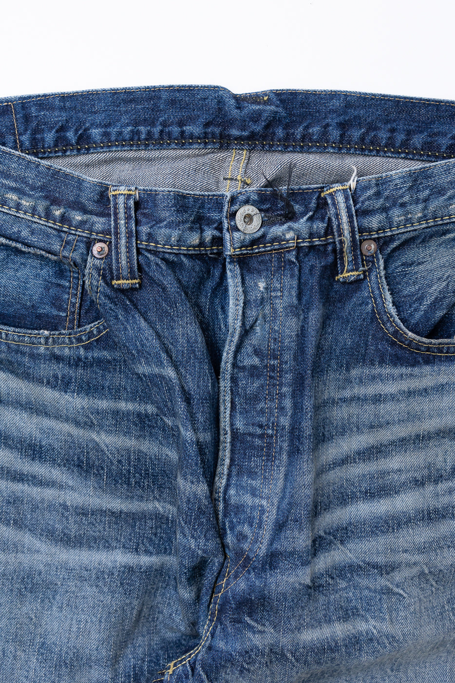 Heavily Washed indigo denim layflat with a 2