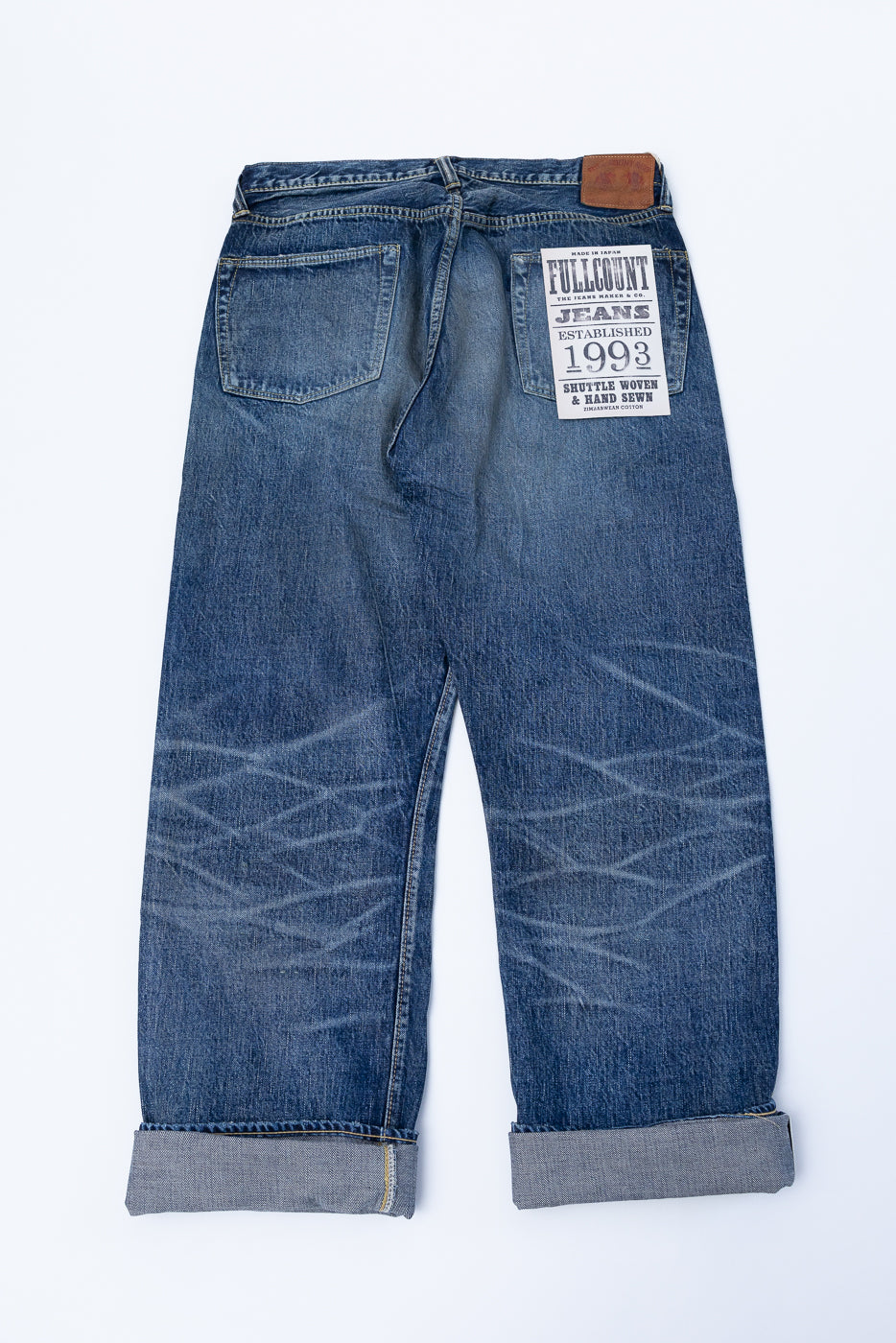 Heavily Washed indigo denim layflat with a 2
