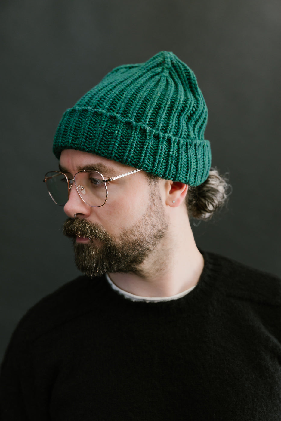 green mix ribbed chunky beanie, watch cap on bearded mans head, side view