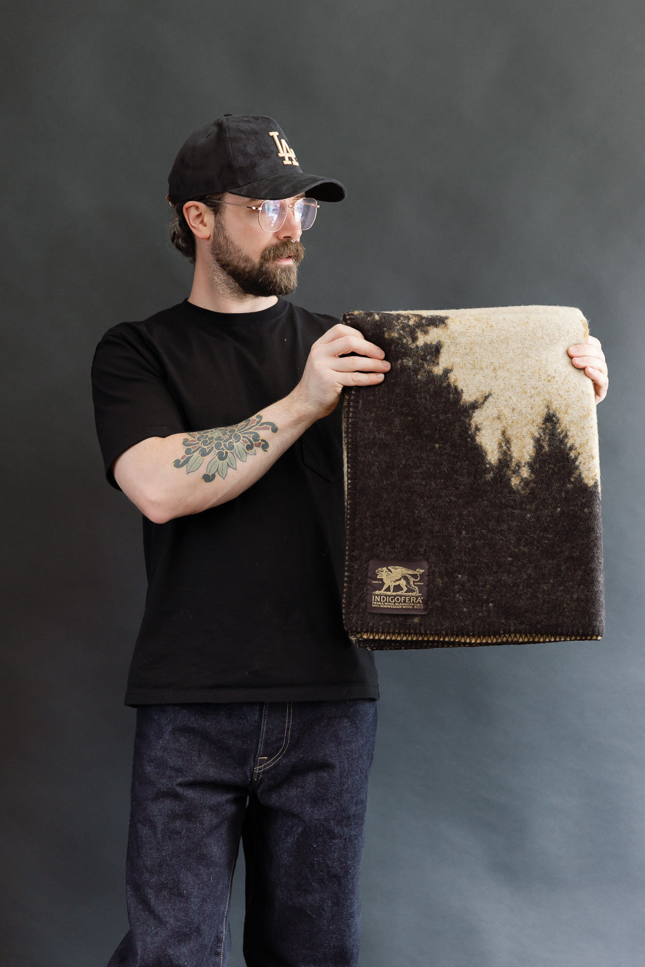 bearded man holding snake river blanket