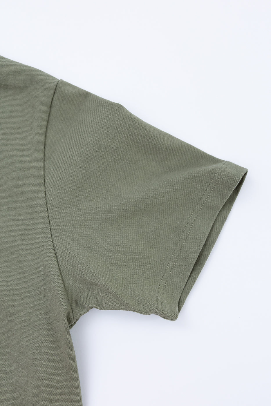 Green t-shirt on a white background