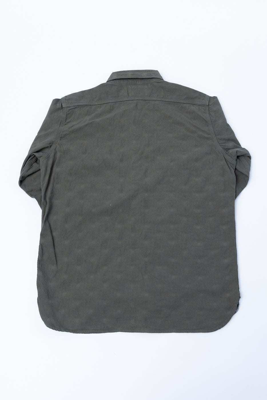 Back view of SSS25-ATW Tropical Weather Dobby Shirt in olive green, showcasing reinforced elbow patches, buttoned barrel cuffs, and slightly rounded hem.