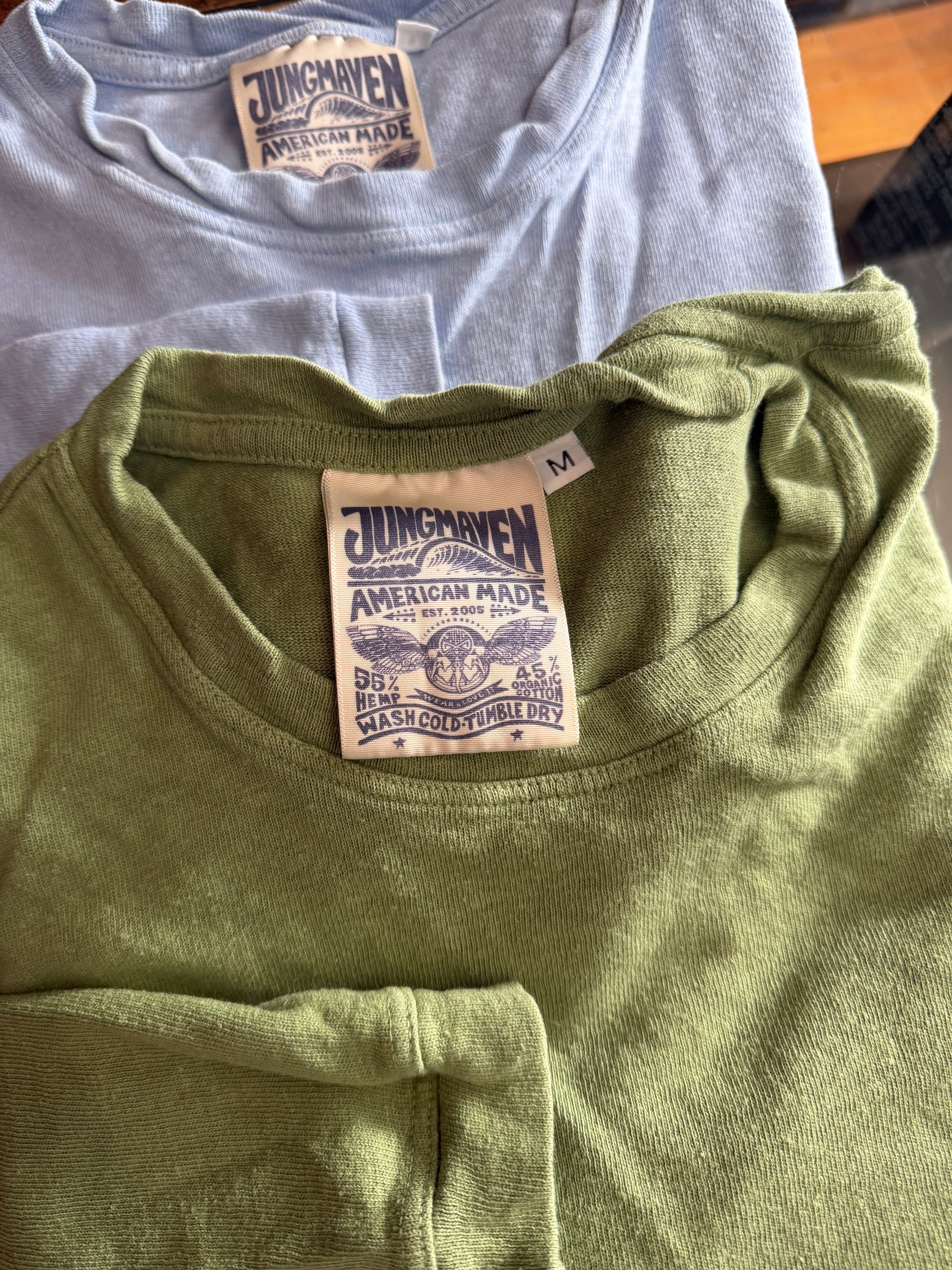 Close-up of Jungmaven American made t-shirt tags, hemp and organic cotton, front neck detail.