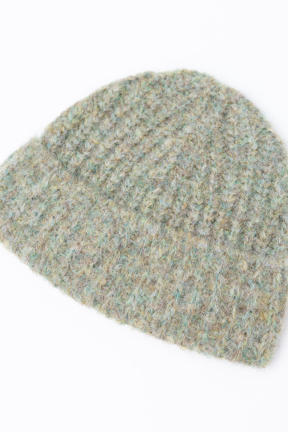 Close-up front view of a textured, multi-color knit beanie in sage and tan hues.
