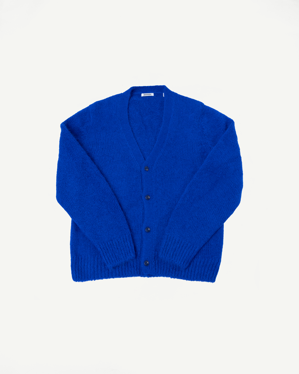 Front view flat lay of a bright blue knit cardigan with button closure.