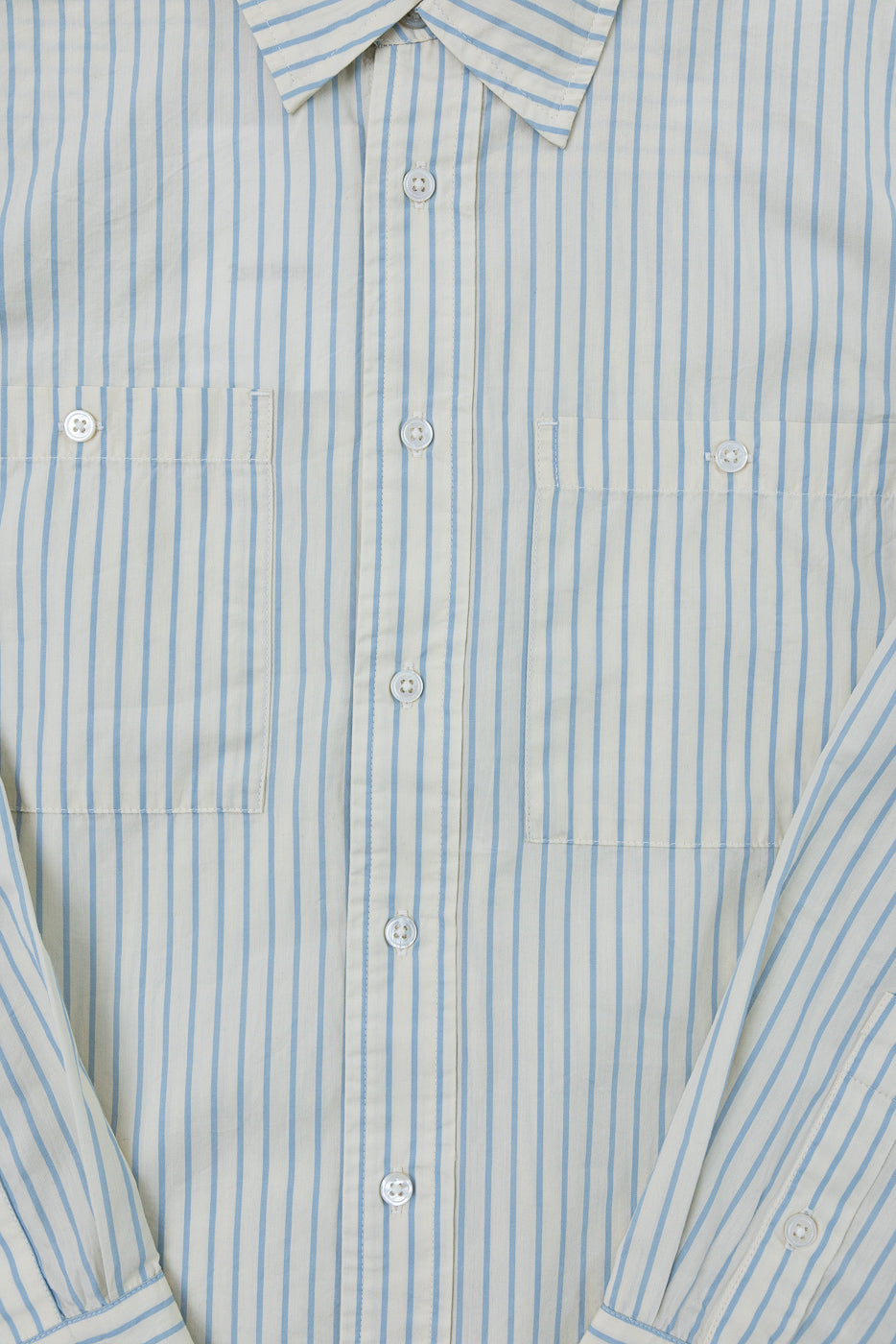 Close-up front view of a blue and white vertical striped button-down shirt showing collar and pockets.