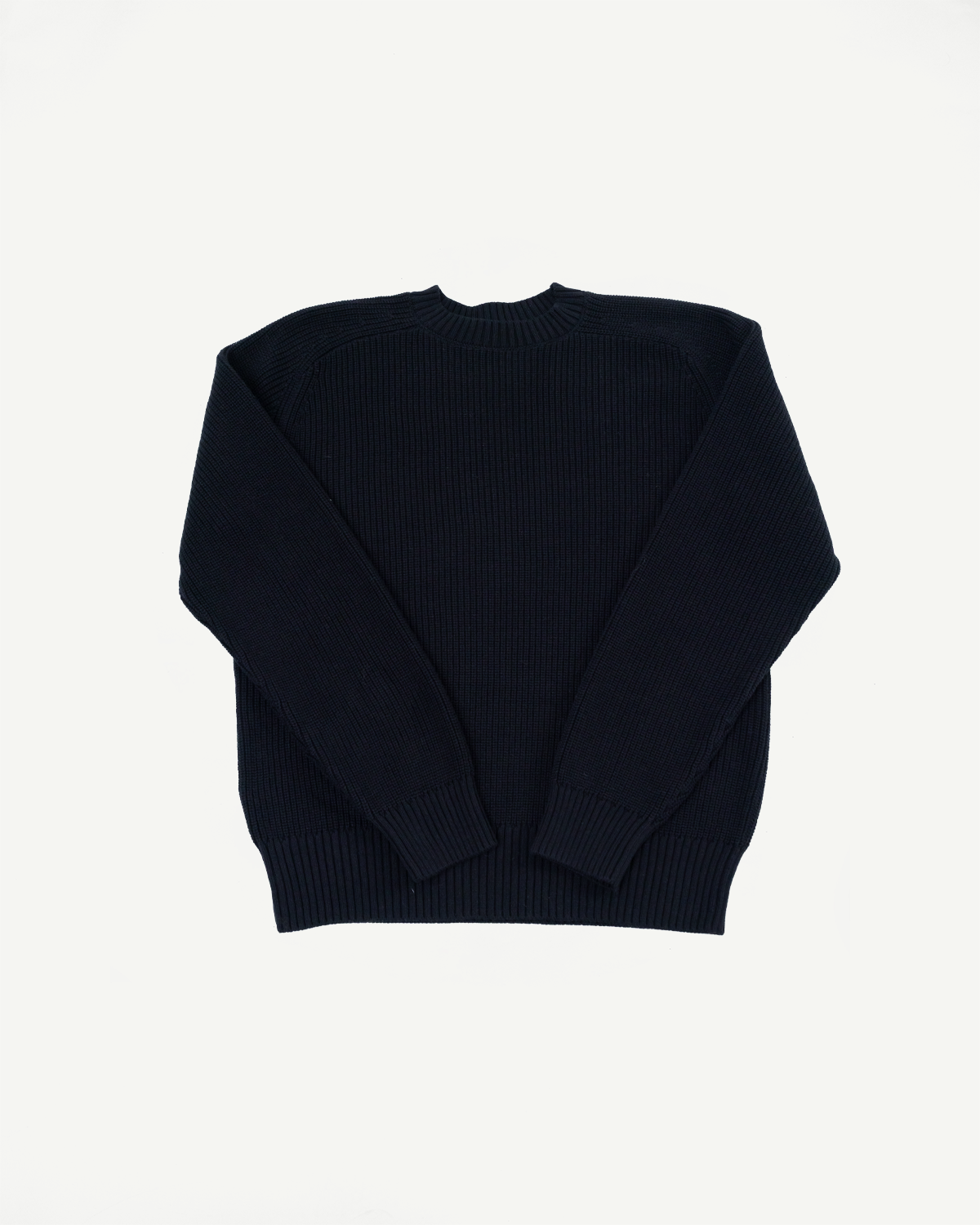 Flat lay front view of a navy blue ribbed knit crewneck sweater.