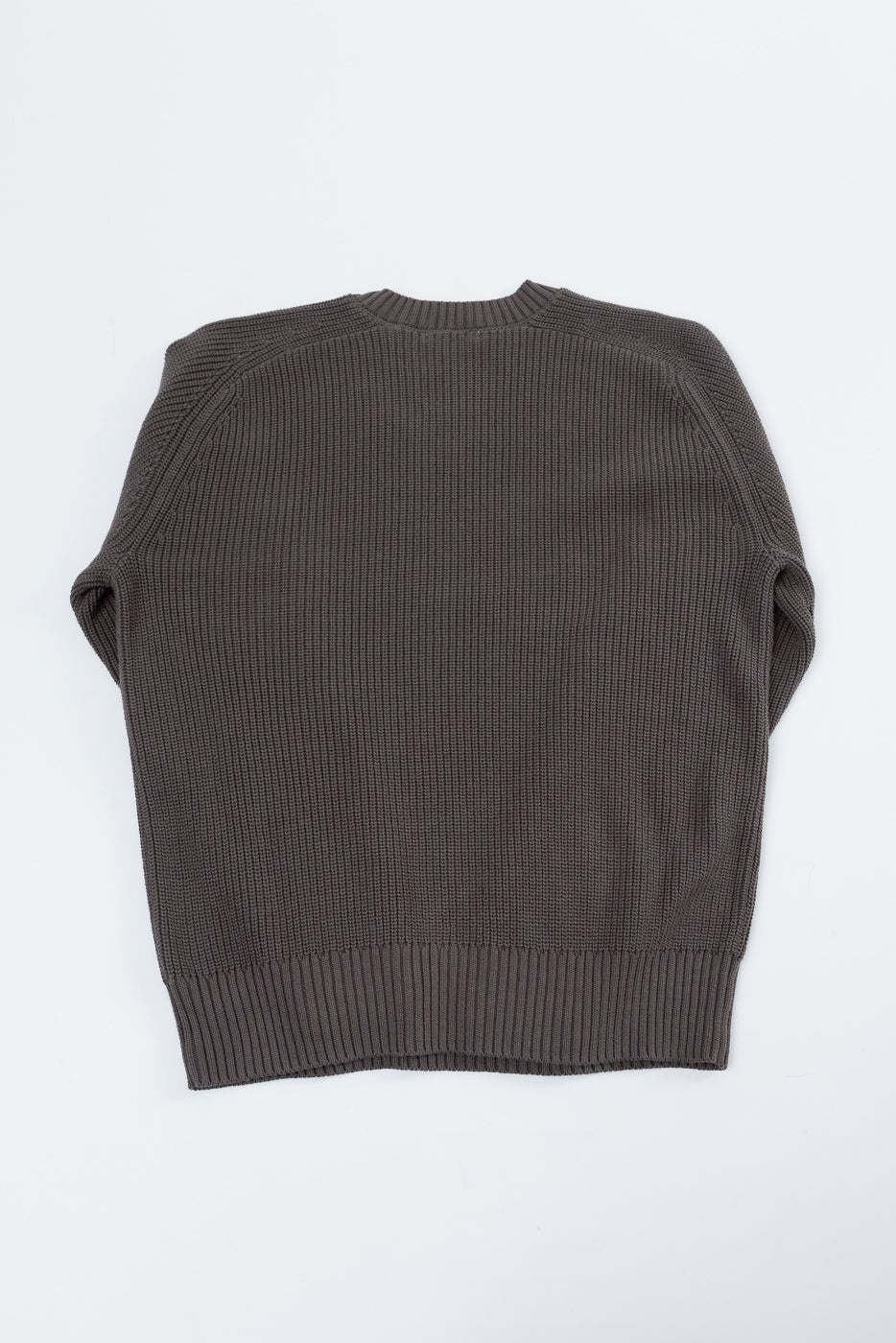 Back view of a dark brown textured knit sweater flat lay.