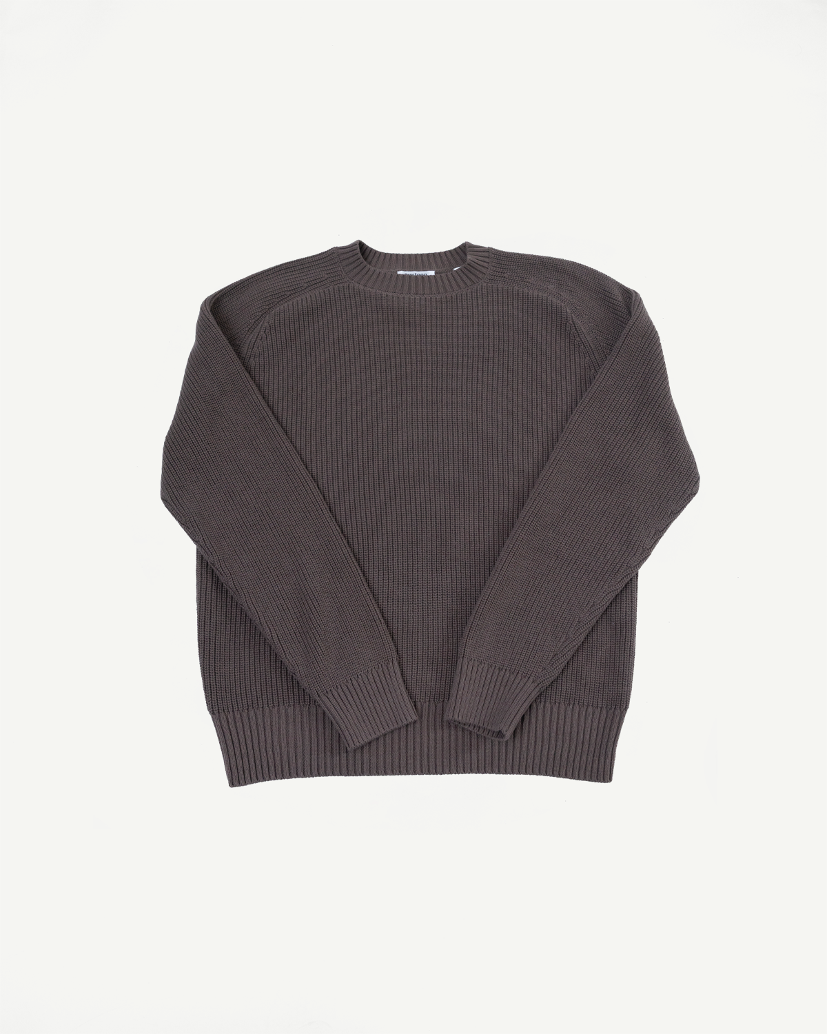 Flat lay front view of a dark charcoal waffle knit crewneck sweater.