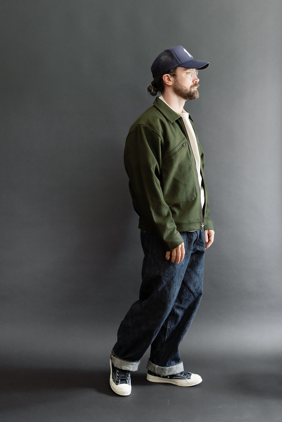 Full body side view of a male model, 5'9