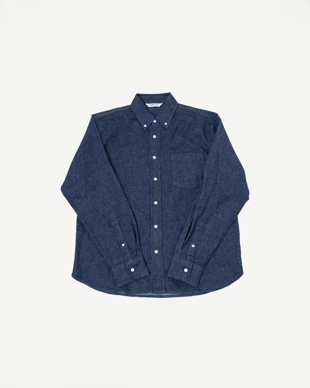 Front view flat lay of a navy blue long-sleeve button-down shirt with a chest pocket.