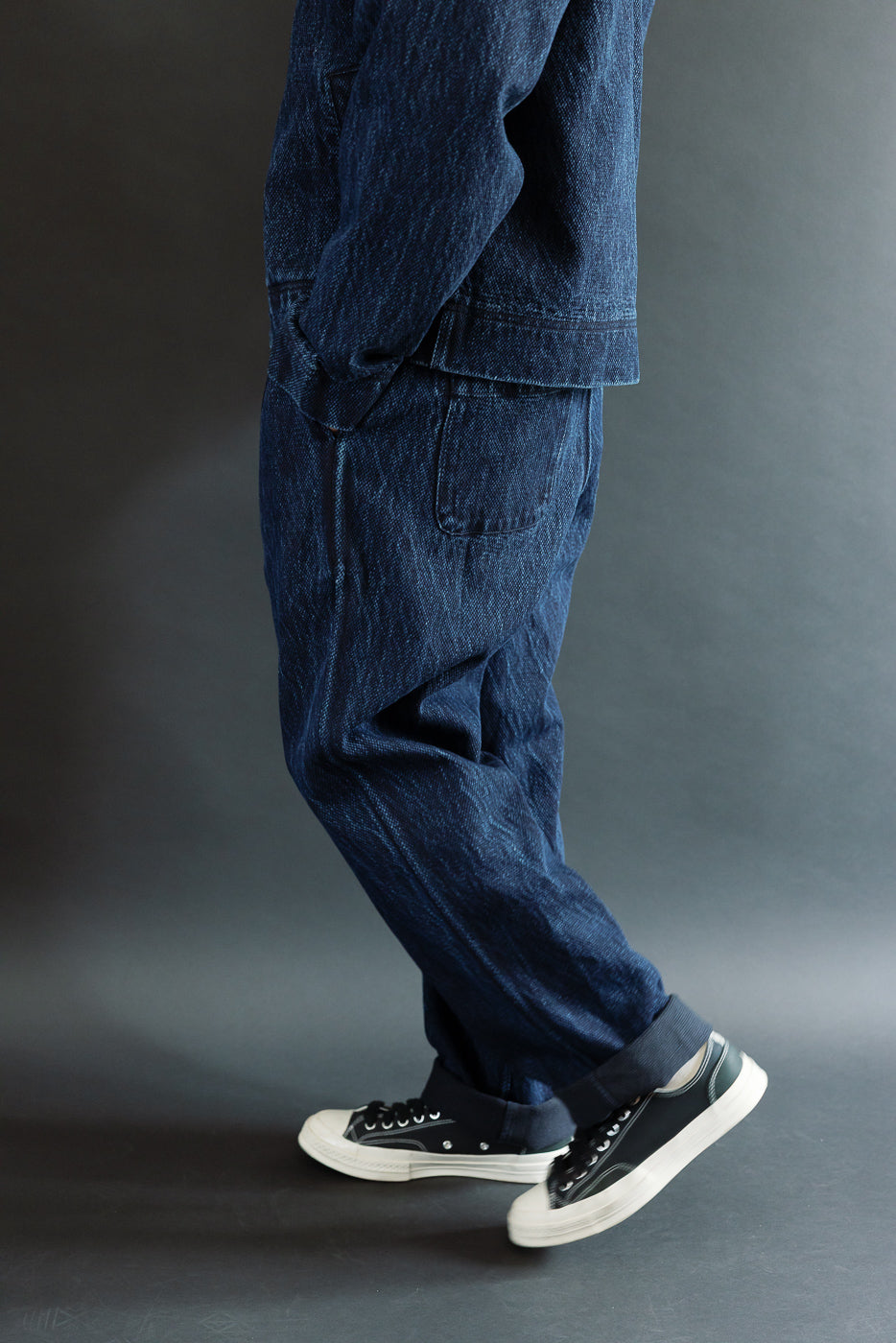 Full body side view of a male model, 5'9