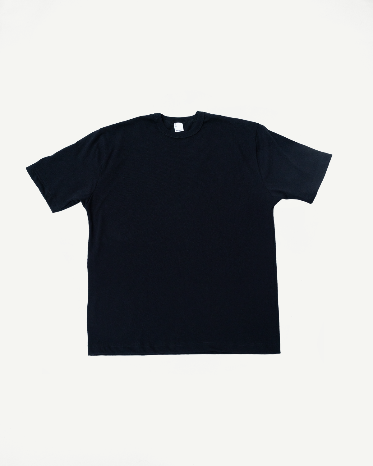 Flat lay front view of heavyweight black boxy T-shirt, short sleeves, ribbed crew neck.