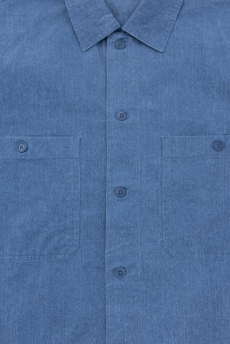 3sixteen Short Sleeve Work Shirt in blue pigment dye, featuring a button-up front with dual cut-corner chest pockets and Corozo buttons, reflecting a modern workwear style with vintage-washed character.