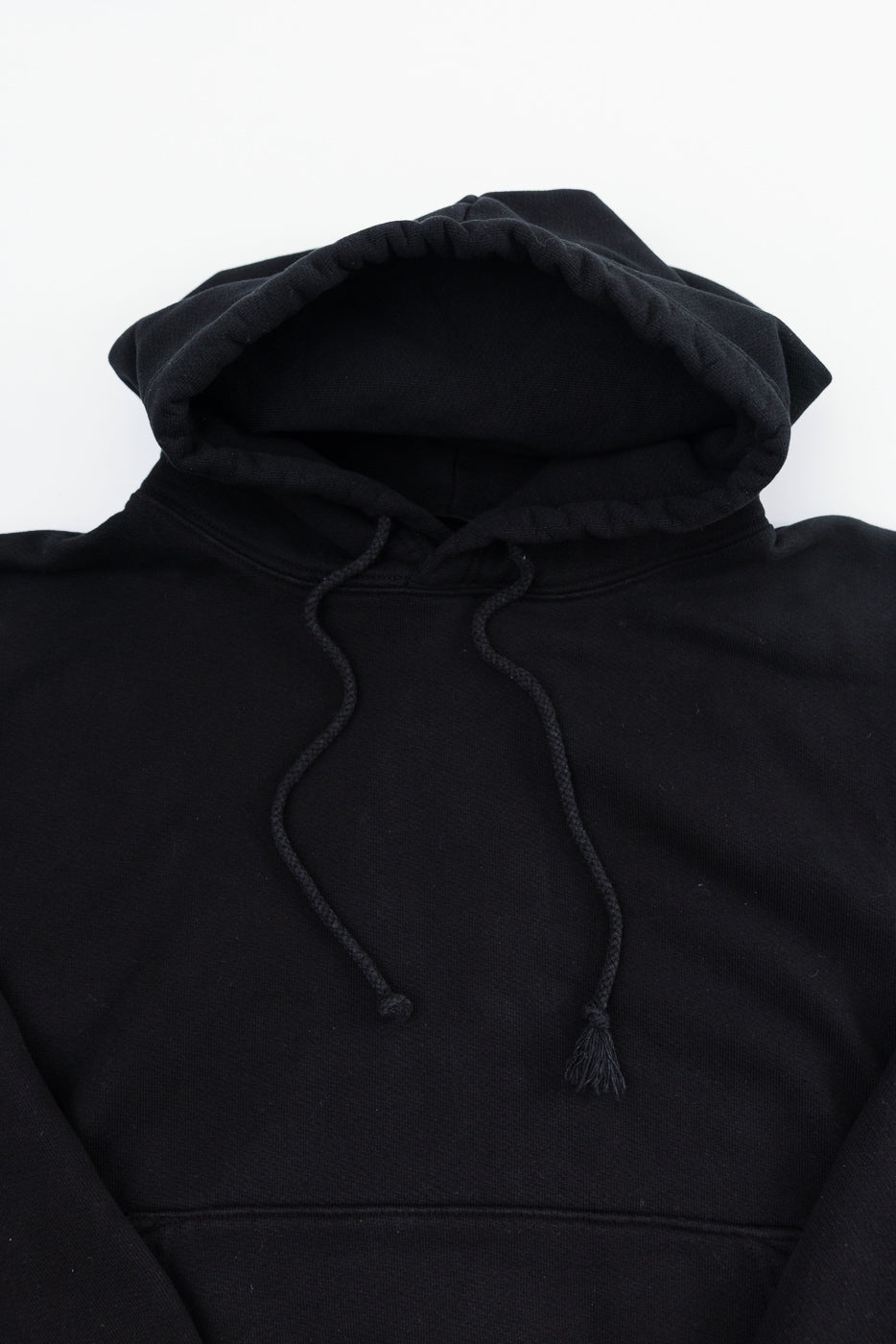 Close-up front view of 3sixteen ultraweight black pullover hoodie showing hood, drawstrings, and fabric texture.