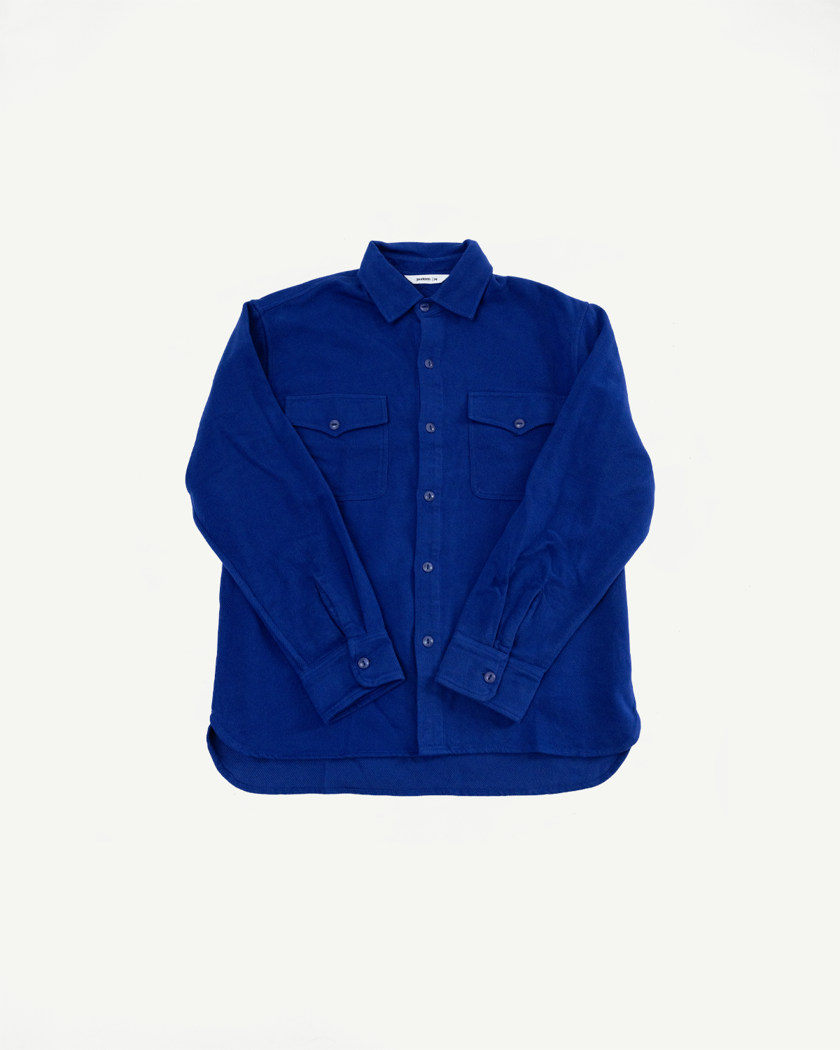 Front view flat lay of a blue long-sleeve button-down shirt with two chest pockets.