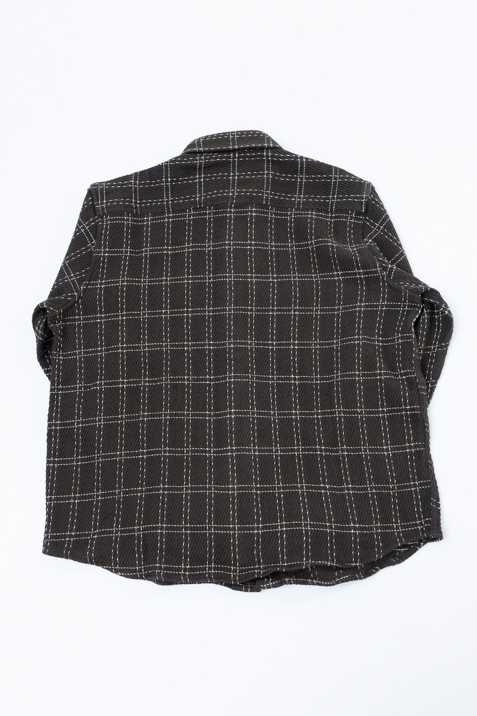 Back view flat lay of a black and white windowpane plaid button-down shirt.