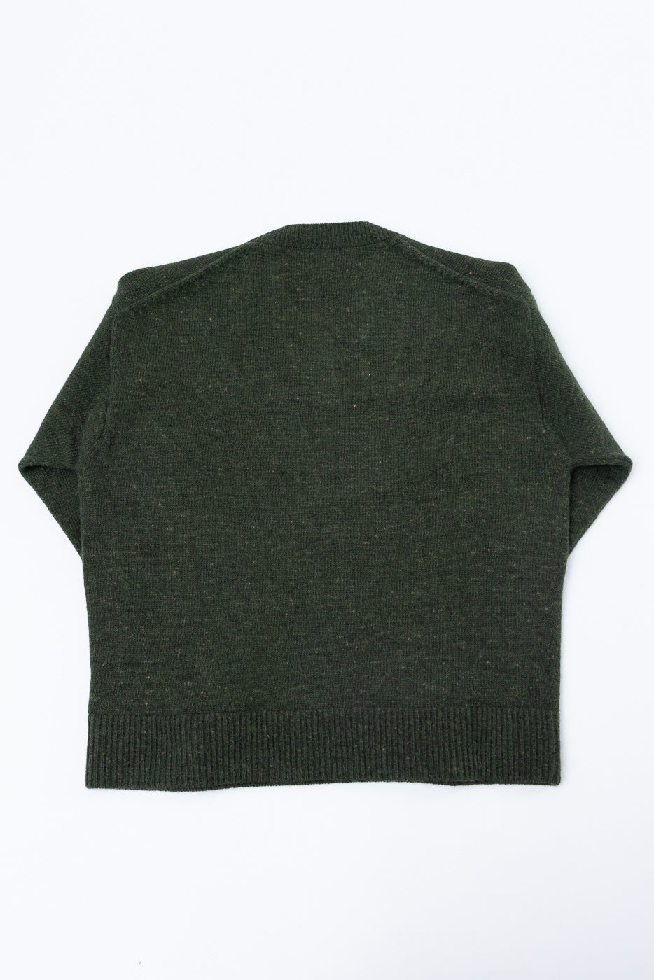 Back view flat lay of a dark green textured knit sweater with ribbed hem.