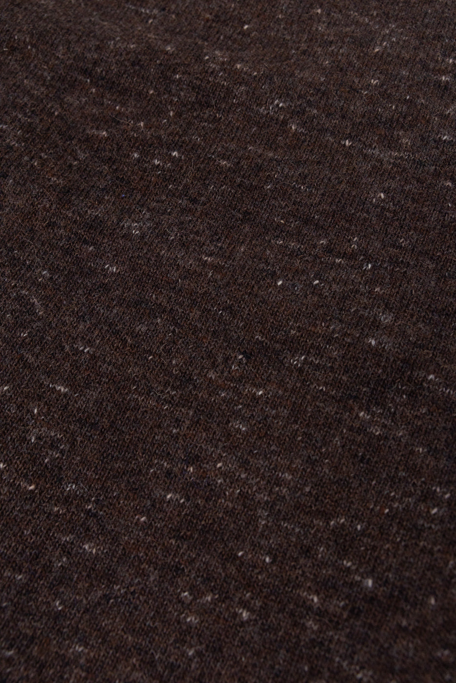 Close-up of dark brown heathered fabric texture.