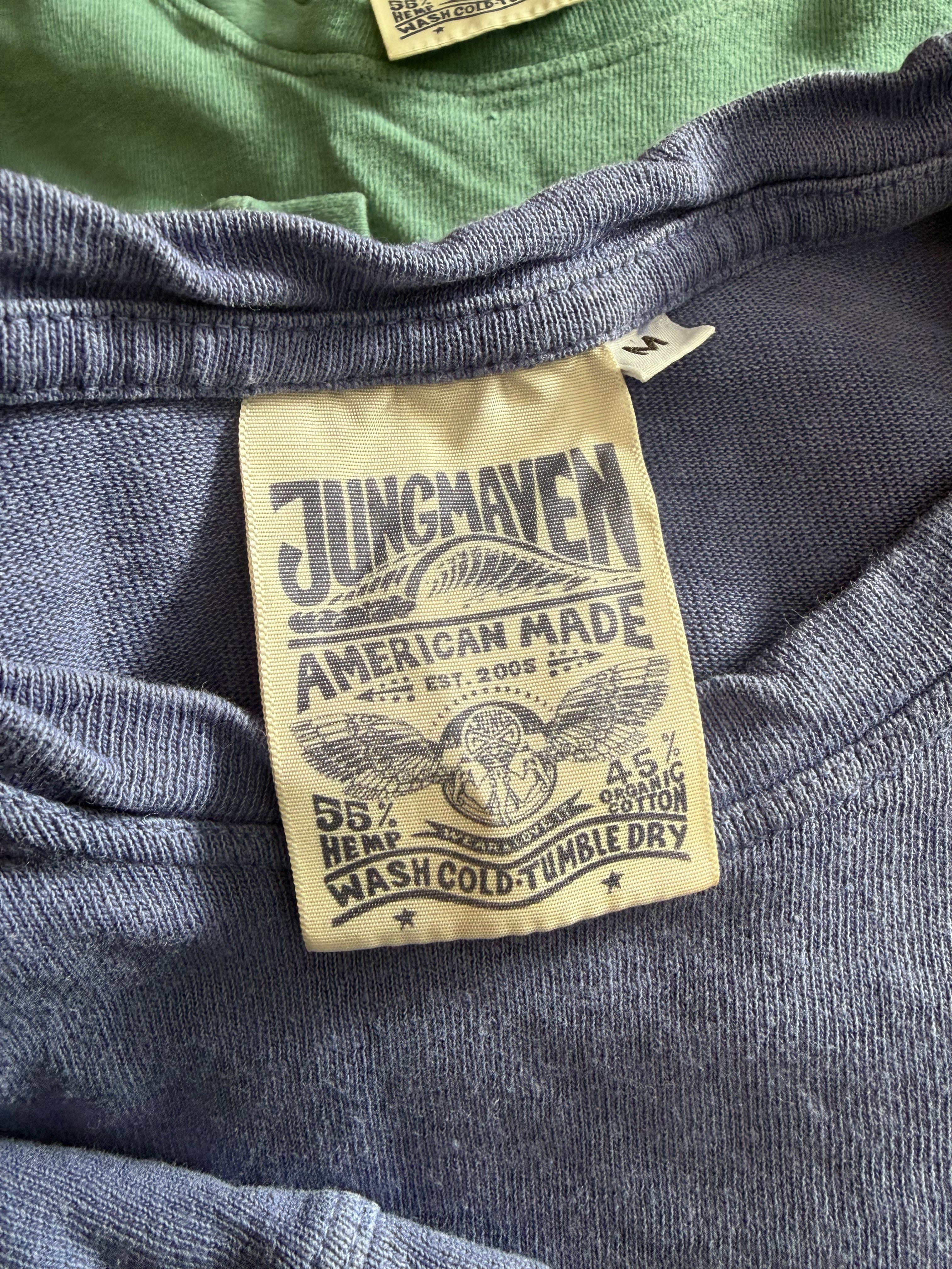 Close-up of Jungmaven shirt neck tag showing front collar, fabric texture, and label details