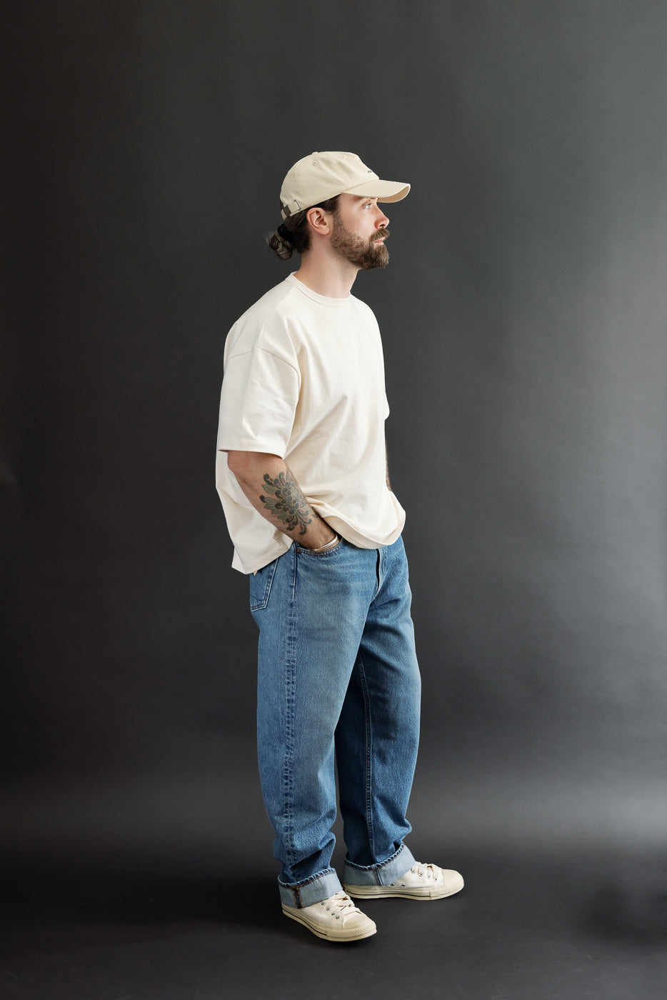 Full body side view of a male model, 5'9