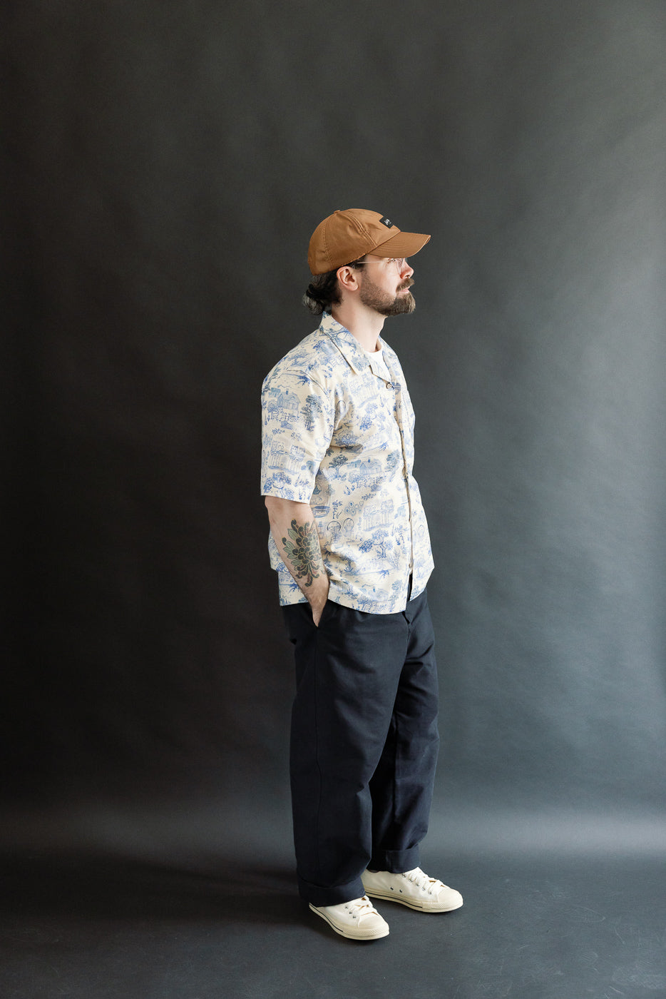 Full body side view of a male model, 5'9