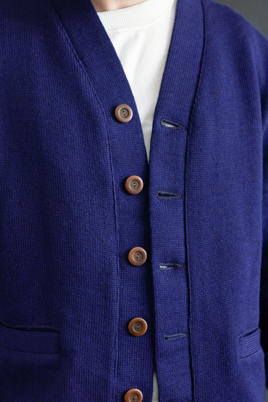 Close-up front view of men's classic purple cardigan, brown buttons, model is 5'9, 165lbs athletic build