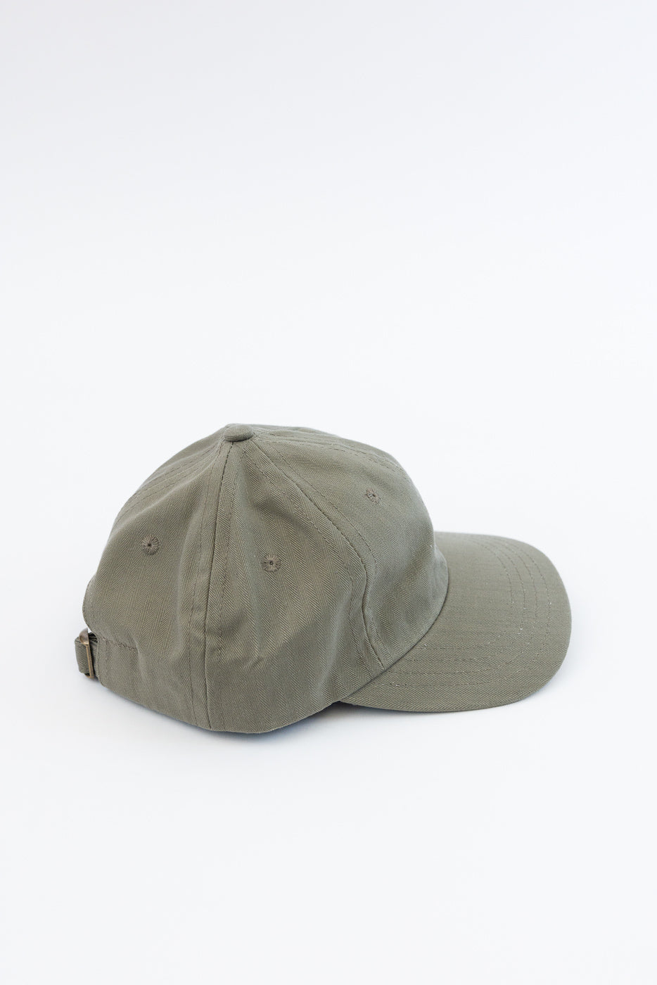 Dry Wax Cotton Baseball Hat - Sage features an olive-green, six-panel design with a curved brim and adjustable strap. Made from 12oz dry wax cotton canvas for a vintage, utilitarian look.