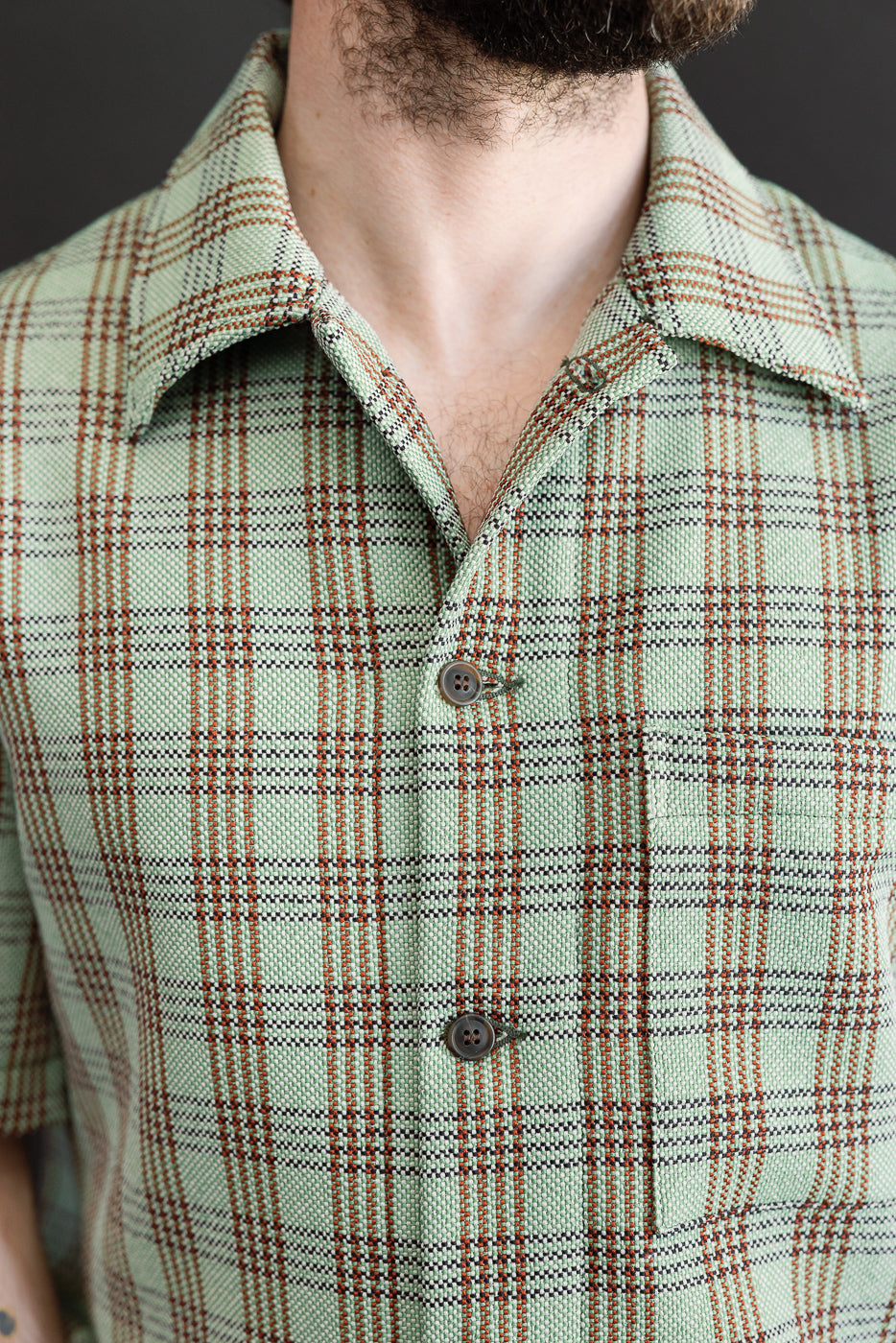 Close-up of front chest and collar on male model, 5'9