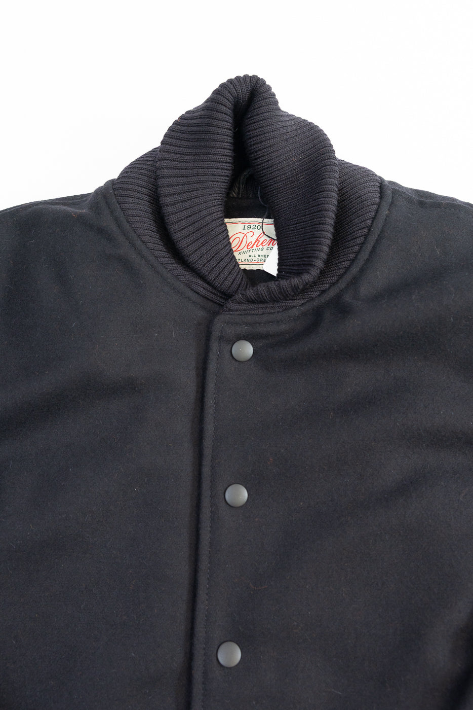 close up of upper half of black jacket