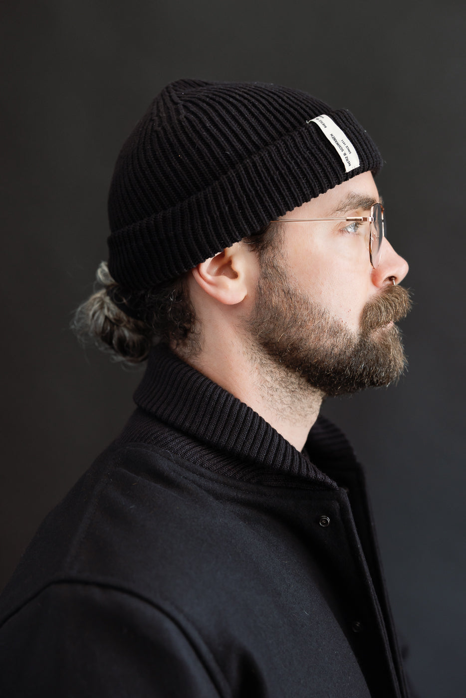 close up of ribbed collar on black wool jacket