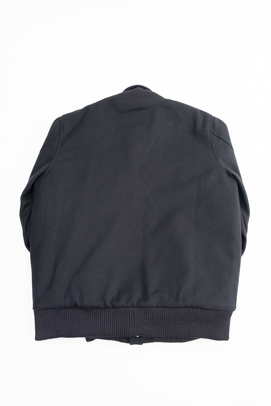 all black varsity jacket on white background, flat lay, back