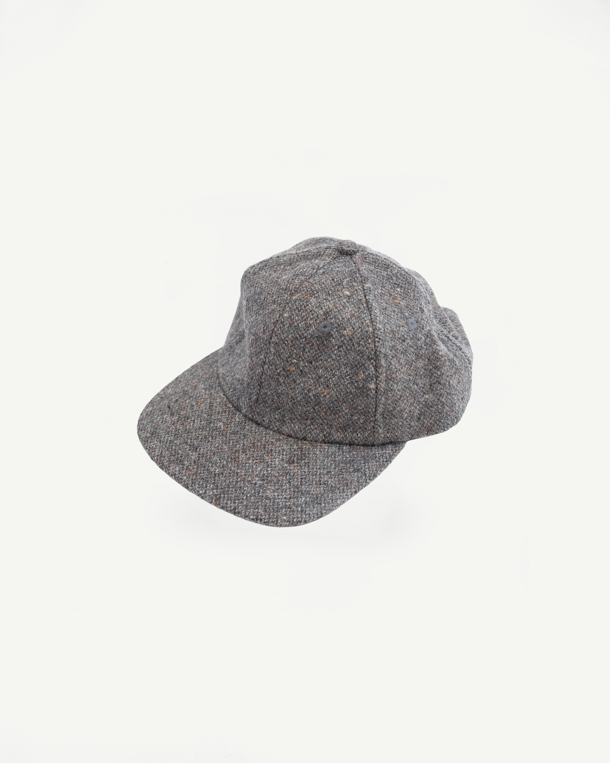 Front angled view of a grey textured wool baseball cap on a white background.