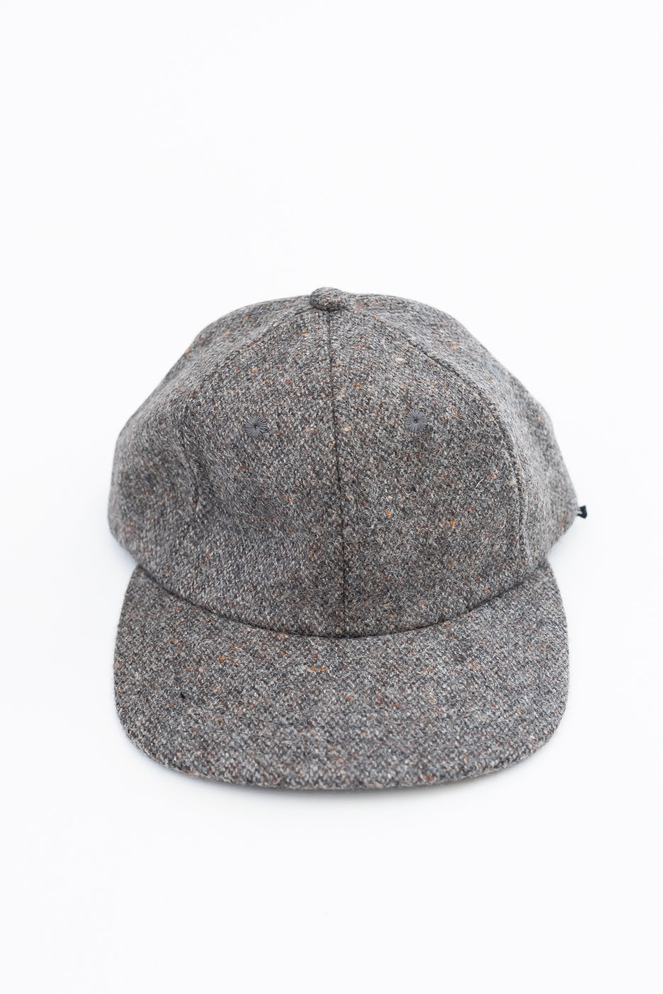 Front view close-up of a grey textured wool baseball cap.