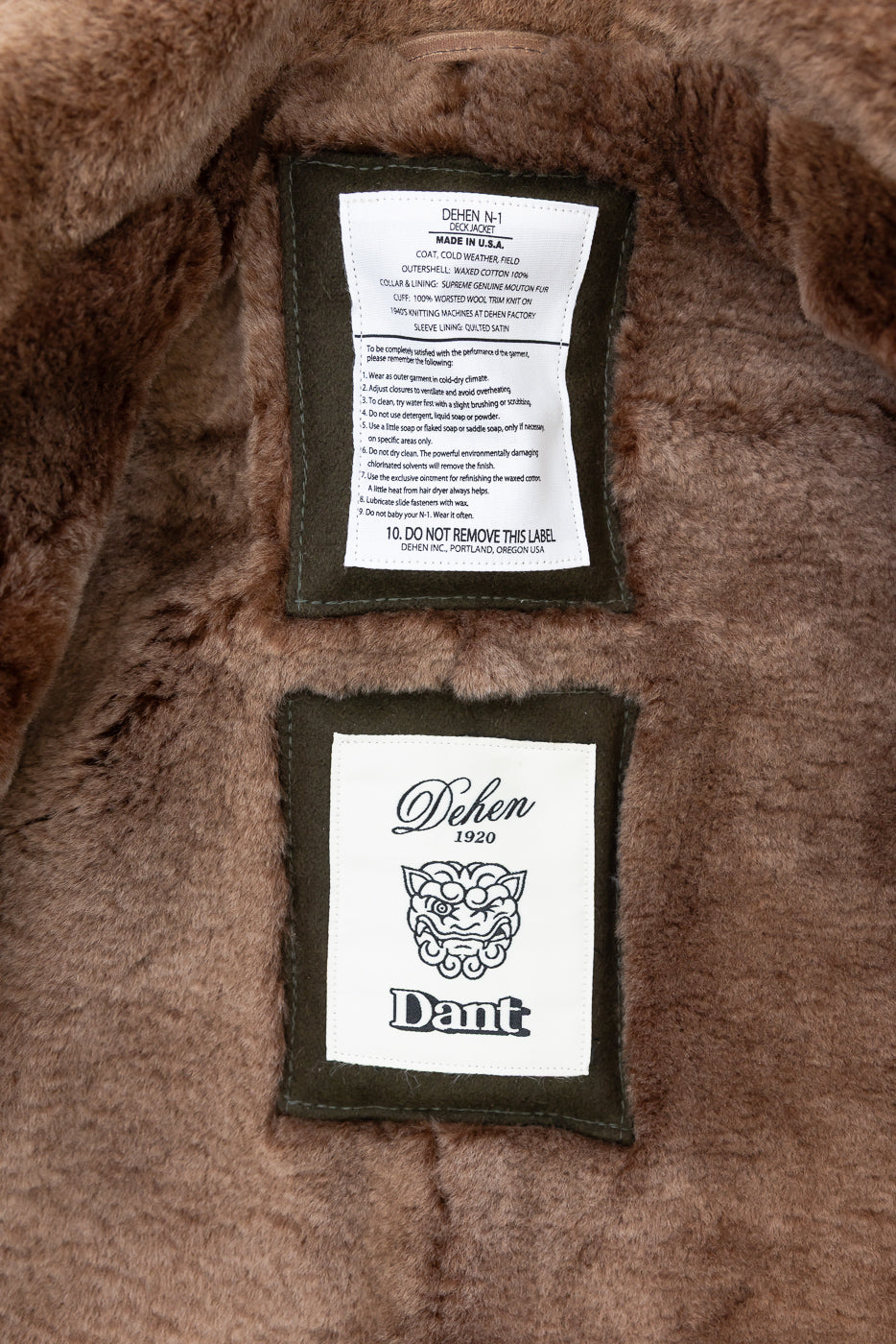 Close-up of the interior back neck area showing the Dehen N-1 Made in USA care label and brand tag.