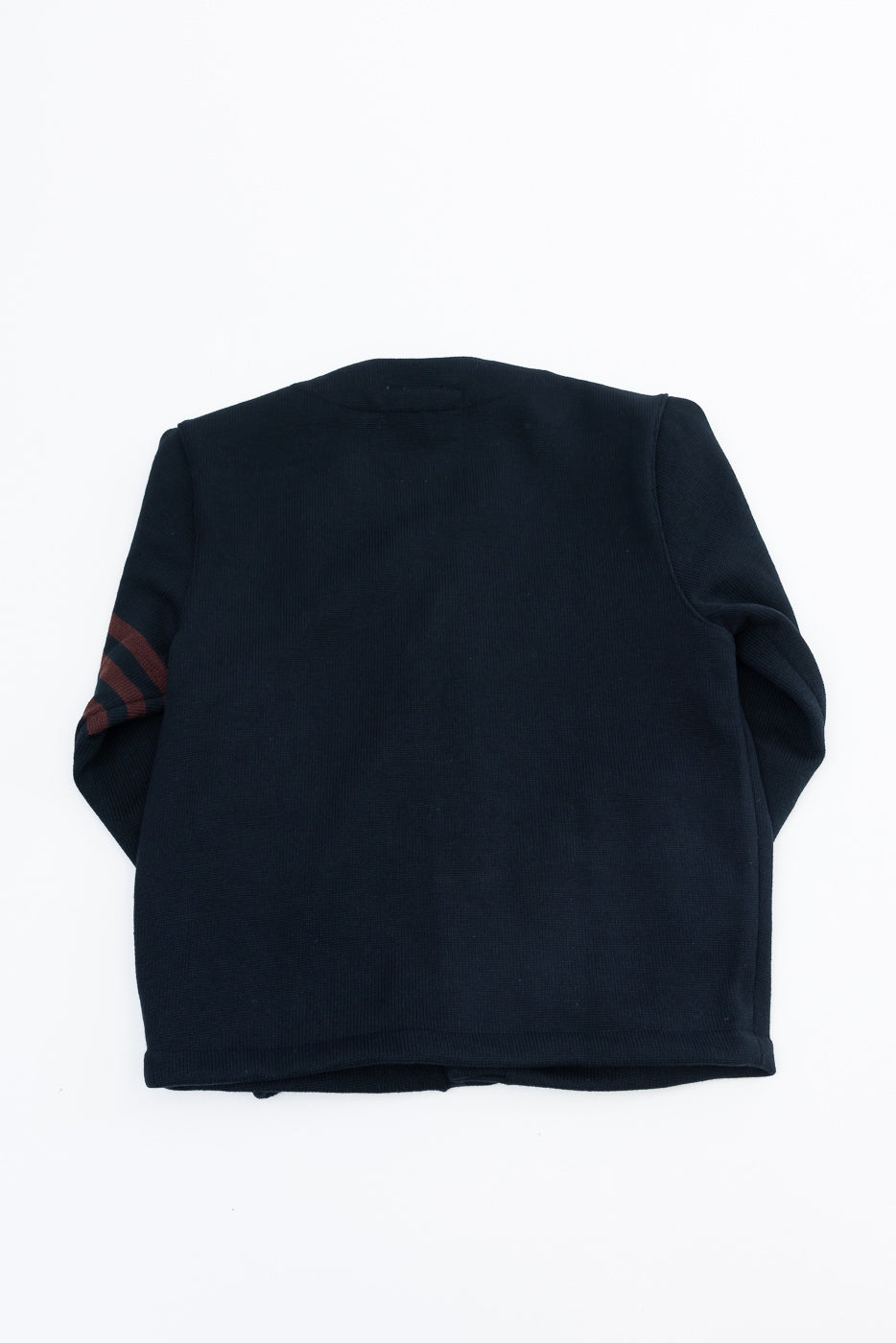 Back view flat lay of a navy blue long sleeve crewneck sweatshirt with red stripe sleeve detail.