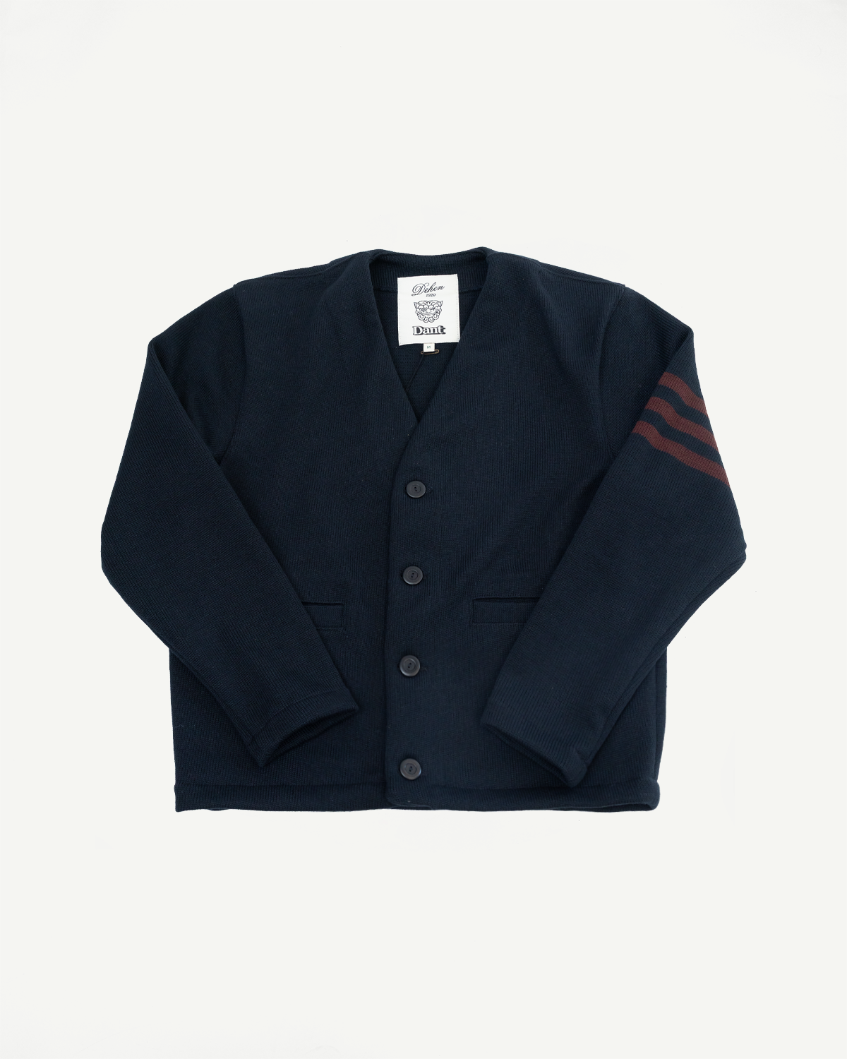 Front flat lay of a navy blue cardigan with four buttons and red sleeve stripes.