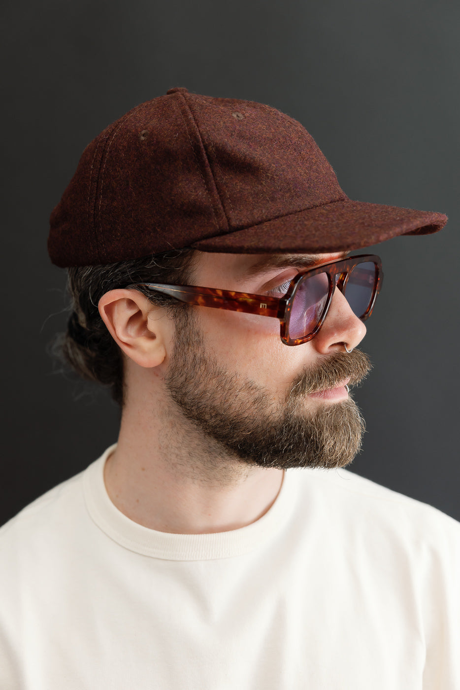 Close-up side profile of a male model, 5'9