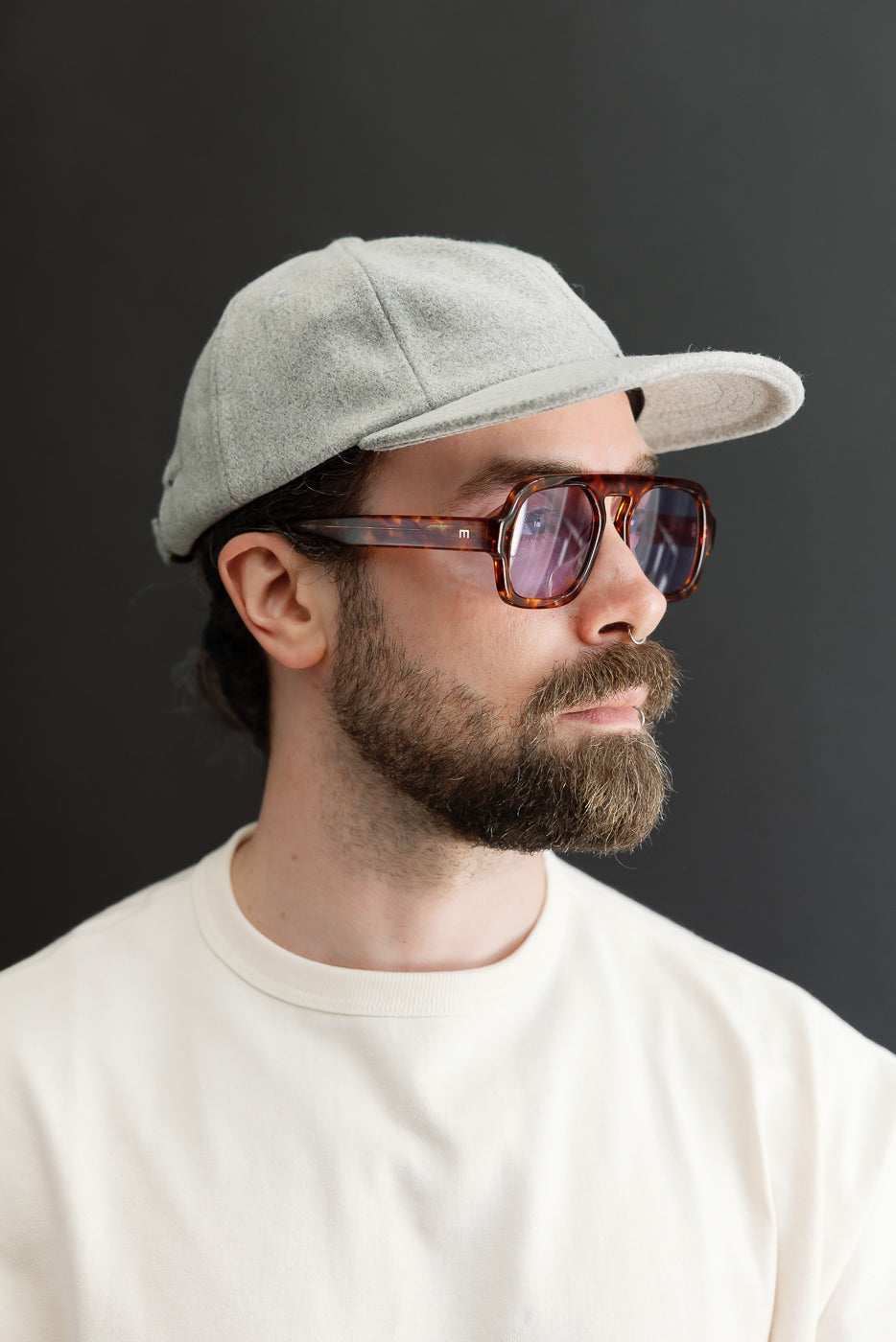 Close-up side view of a male model (5'9