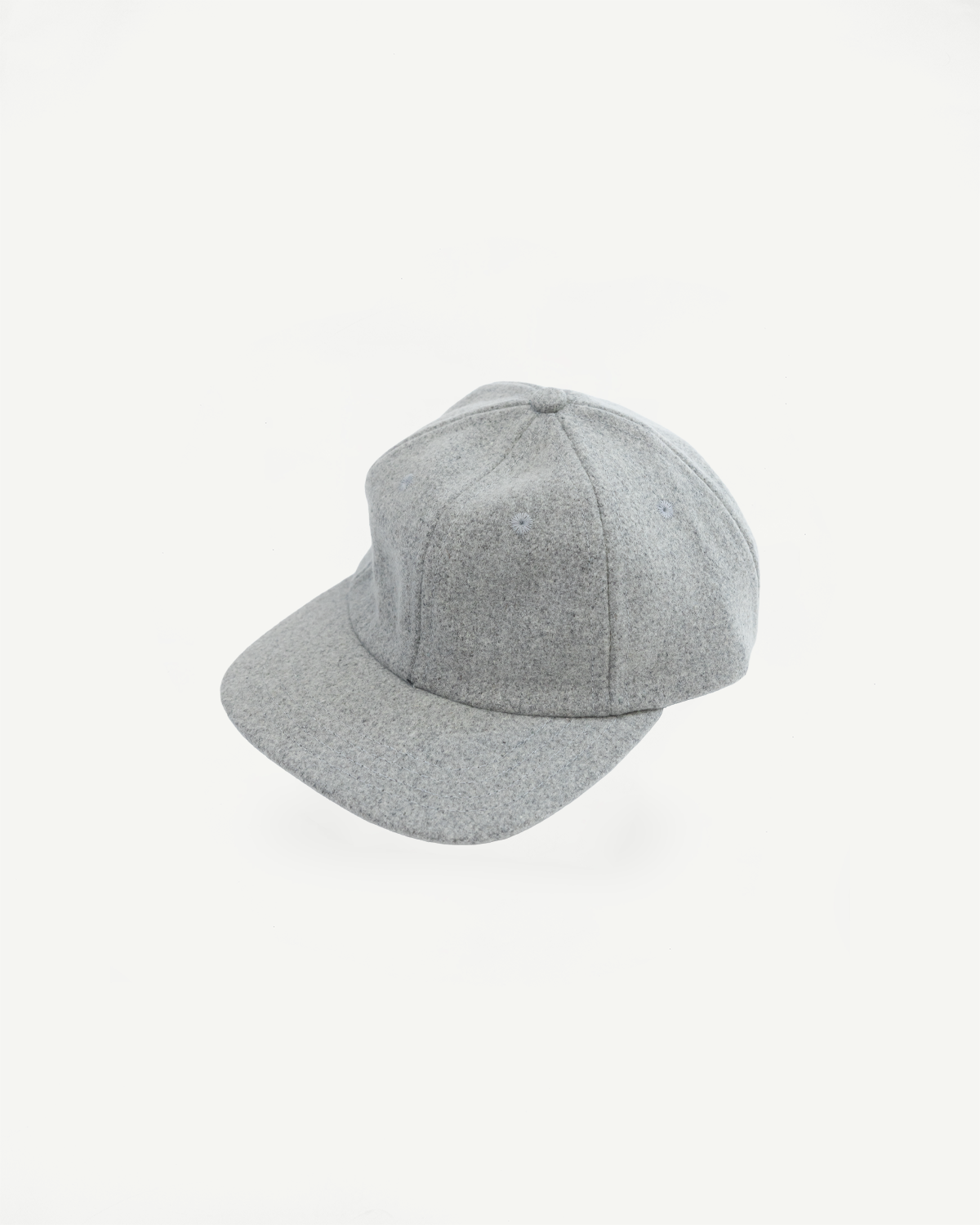 Front view close-up of a grey textured wool baseball cap on a white background.