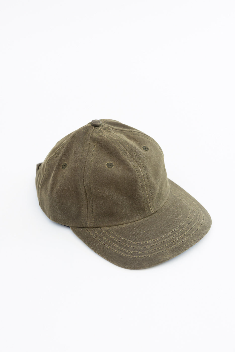Front view of an olive green cotton twill baseball cap on a white background.