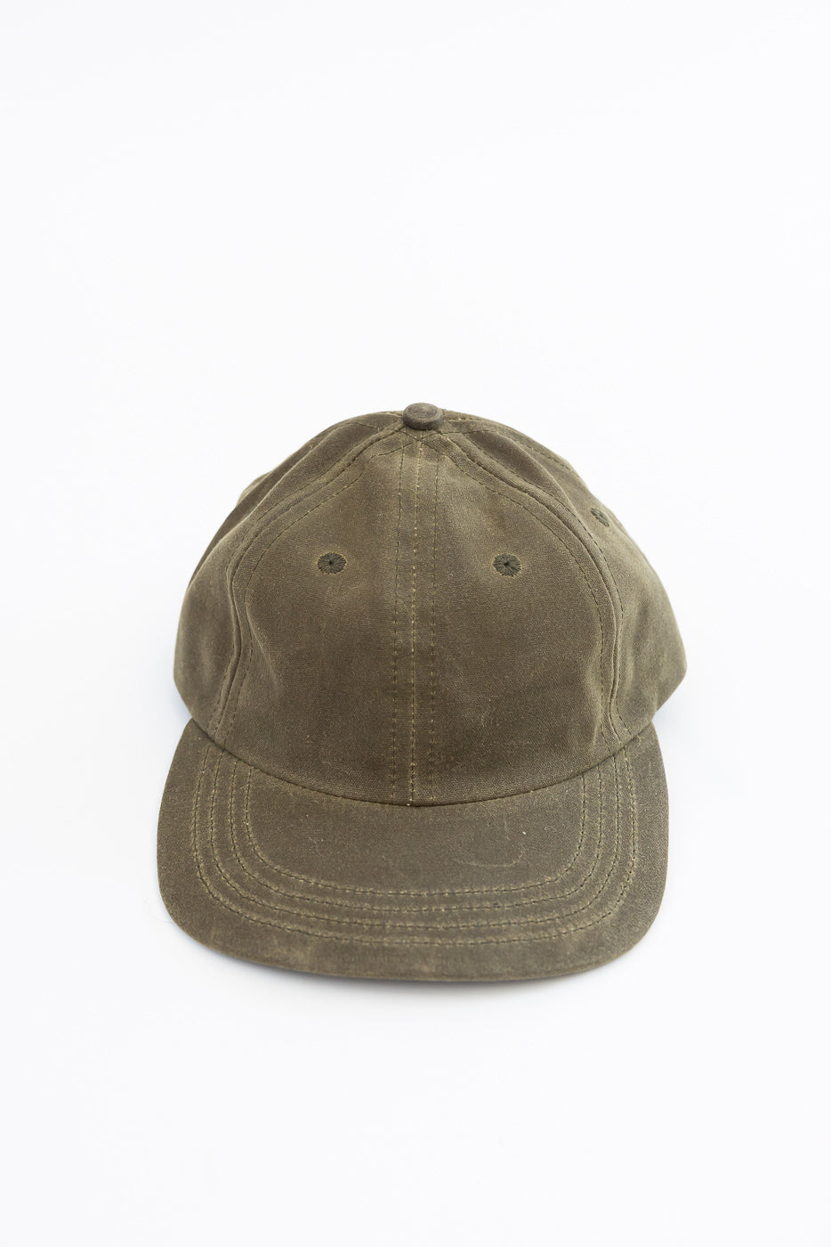 Front view flat lay of an olive green cotton baseball cap.