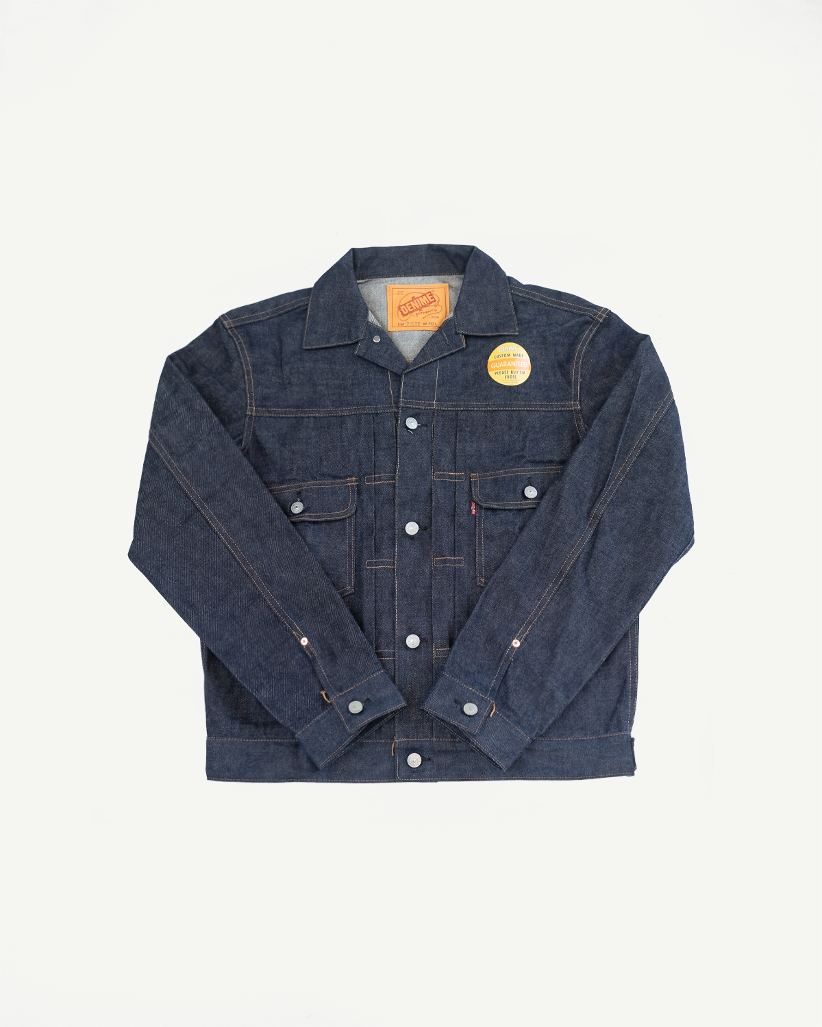 Blue denim jacket on a light gray background