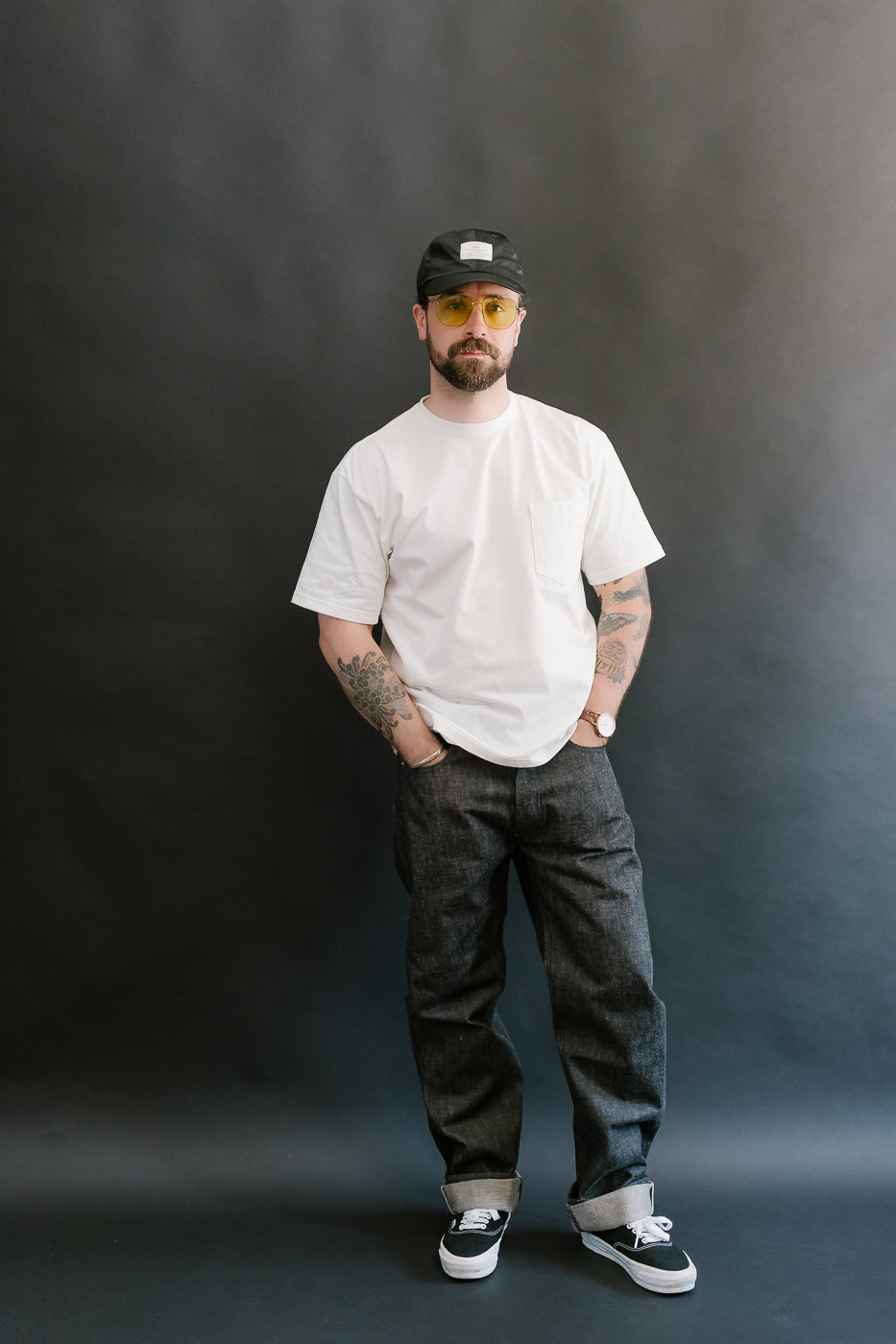 man wearing black mother cotton denim jeans full body, front