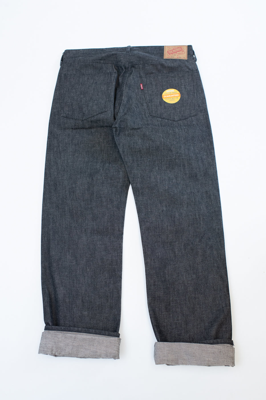 back image of black jeans on a white background