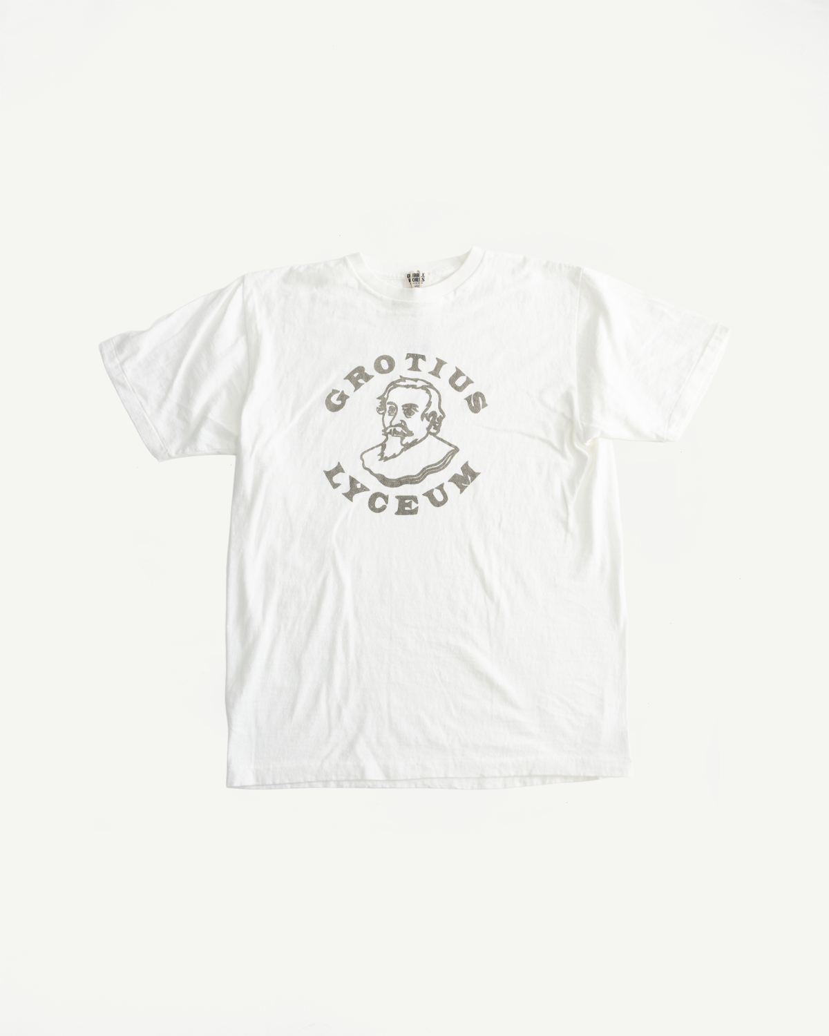 5.4oz Raffy Tenjiku Printed T-Shirt Grotius - Off White, featuring a stylized bust of a bearded man with GROTIUS and LYCEUM text, crafted from Japanese organic cotton for a vintage-inspired look.